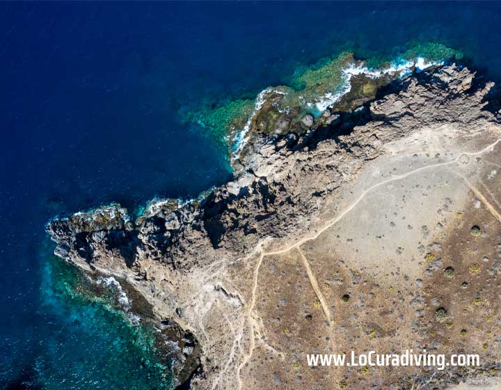 Straight-down aerial view of El Balito showcasing the coastline and turquoise waters