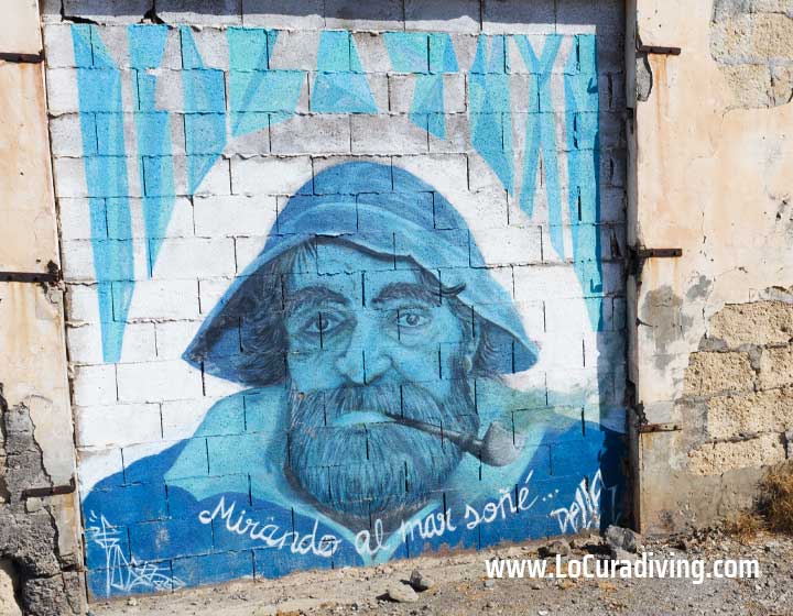 Aerial view of graffiti depicting a sailor with the quote