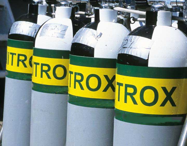 Image of several nitrox tanks prepared for the Enriched Air Nitrox Specialty course at a dive shop.