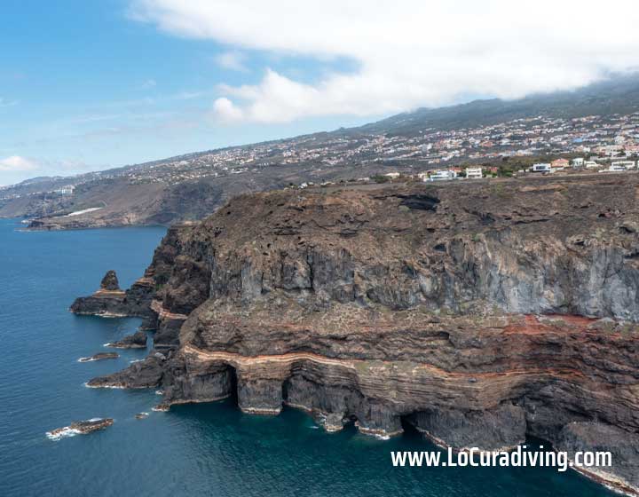 Aerial image of Tenerife’s northern coastline near La Rapadura dive site with rugged cliffs and natural rock formations.